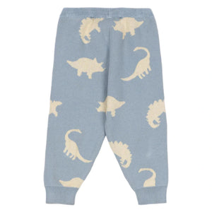 The Konges Slojd Baby Boys' and Boys' Lapis Knit Pants feature a light blue jacquard knit with an all-over cream dinosaur silhouette pattern, plus elastic waistband and cuffs for comfort.