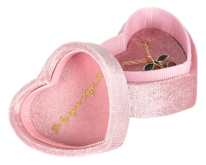The Little Necklace Box by Konges Slojd is a pink velvet heart-shaped jewellery box with gold cursive writing and a heart inside the lid, elegantly holding a necklace with a cherry pendant.
