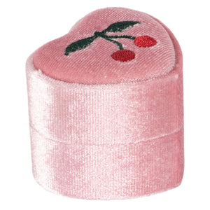 The Konges Slojd Little Necklace Box is a pink, heart-shaped velvet jewellery box with two embroidered cherries and green leaves on the lid, ideal for storing a delicate necklace. Photographed against a white background.