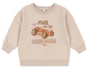 The Konges Slojd Baby Boys' and Boys' Lou Sweat Shirt is made from organic cotton, featuring ribbed cuffs and a vintage race car print with the text "Fuel for the fast lane.
