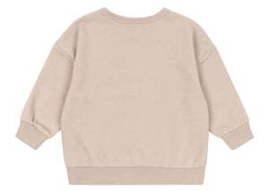 The Baby Boys' and Boys' Lou Sweat Shirt by Konges Slojd is shown from the back in beige, featuring ribbed cuffs, hem, and collar. Made from soft organic cotton for comfortable everyday wear.