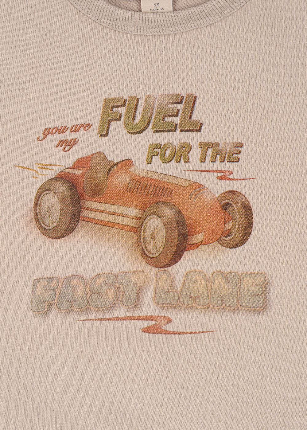 This beige Konges Slojd Baby Boys’ and Boys’ Lou Sweat Shirt features a vintage red race car and the phrase "You are my fuel for the fast lane" printed above and below.