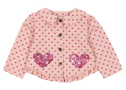 The Konges Slojd Baby Girls' and Girls' Nola Sequin Shirt Jacket features pink cotton twill, a small heart pattern, sequin heart patches on the front, button closure, and cute frill hems.