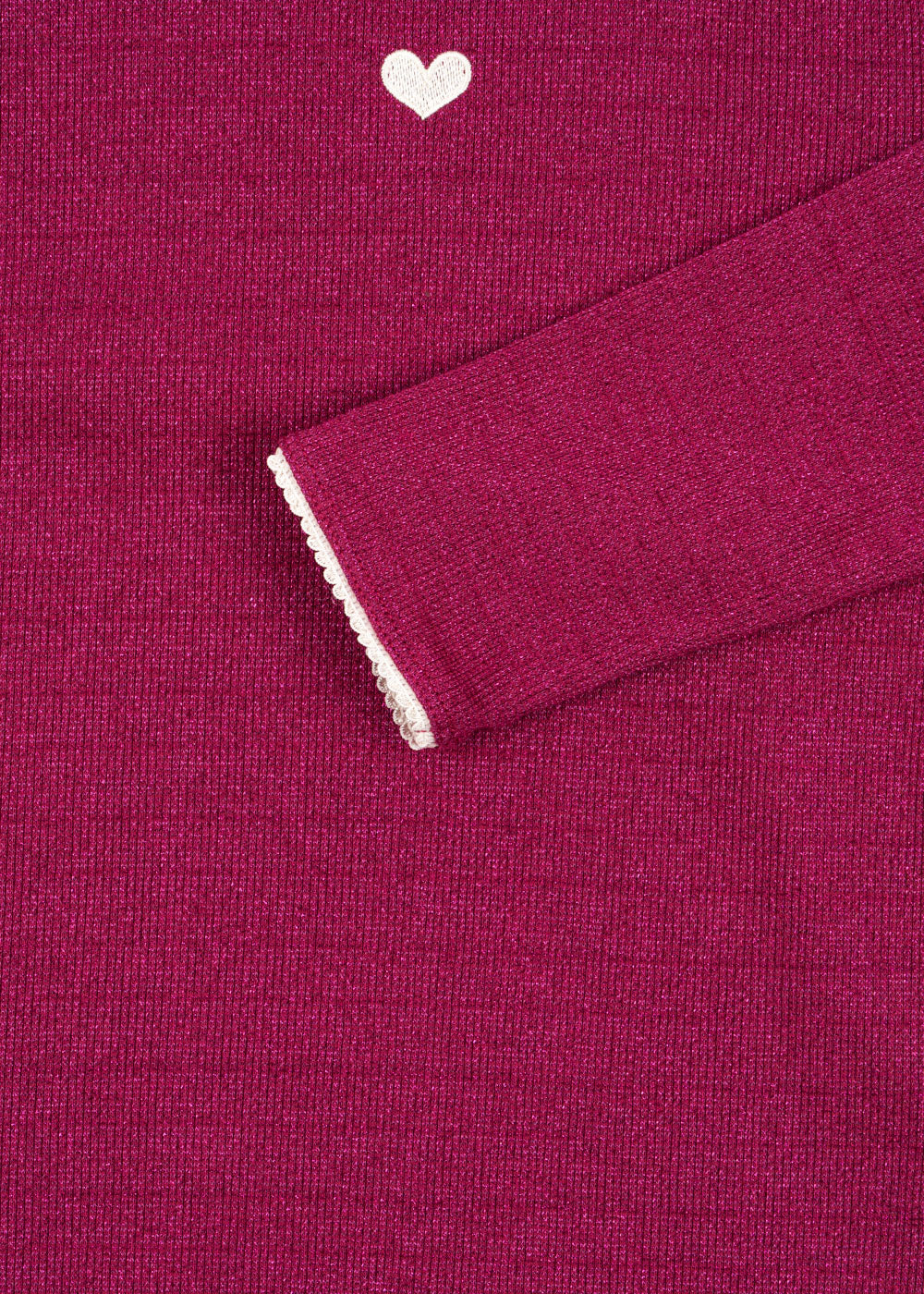 A close-up of the Konges Slojd Baby Girls' and Girls' Roli Blouse, featuring long magenta ribbed sleeves, a white heart near the neckline, and white-trimmed cuffs—an ideal everyday piece.