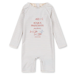 The Baby Boys’ Aster Onesie Swimsuit by Konges Slojd features long sleeves and classic stripes, with cheerful “ACQUA FRIZZANTE” text and fish illustrations printed in red and blue on the front. Designed to provide a comfortable fit, this romper also adds a layer of UV protection for little ones during sunny days.