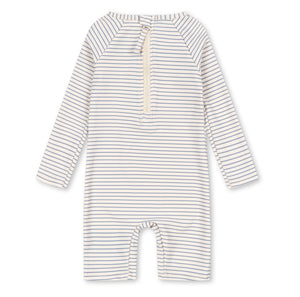 The Konges Slojd Baby Boys’ Aster Onesie Swimsuit is a long-sleeve romper featuring thin horizontal stripes and a front zipper closure, designed as a swim onesie with built-in UV protection, shown on a white background.