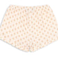 Konges Slojd Baby Girls’ and Girls’ Coco Shorts, featuring a light color, elastic waistband, small floral print pattern, and subtle ruffles at the hem, displayed on a white background.