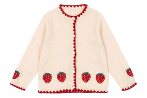 The Girls' Collette Cardigan by Konges Slojd features a cream knit with red strawberry embroidery on the hem and sleeves, red scalloped edges, and mother of pearl button closure.