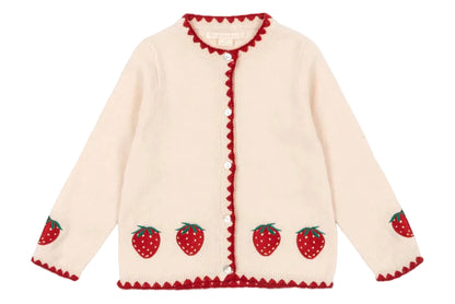 The Girls' Collette Cardigan by Konges Slojd features a cream knit with red strawberry embroidery on the hem and sleeves, red scalloped edges, and mother of pearl button closure.