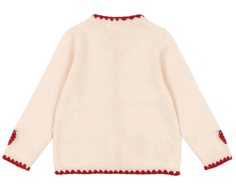 The Girls' Collette Cardigan by Konges Slojd is a cream-colored, long-sleeve knit with red scalloped trim on the collar, cuffs, and hem, plus strawberry embroidery on the elbows. Shown from the back.
