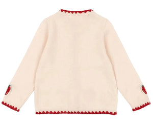The Girls' Collette Cardigan by Konges Slojd is a cream-colored, long-sleeve knit with red scalloped trim on the collar, cuffs, and hem, plus strawberry embroidery on the elbows. Shown from the back.