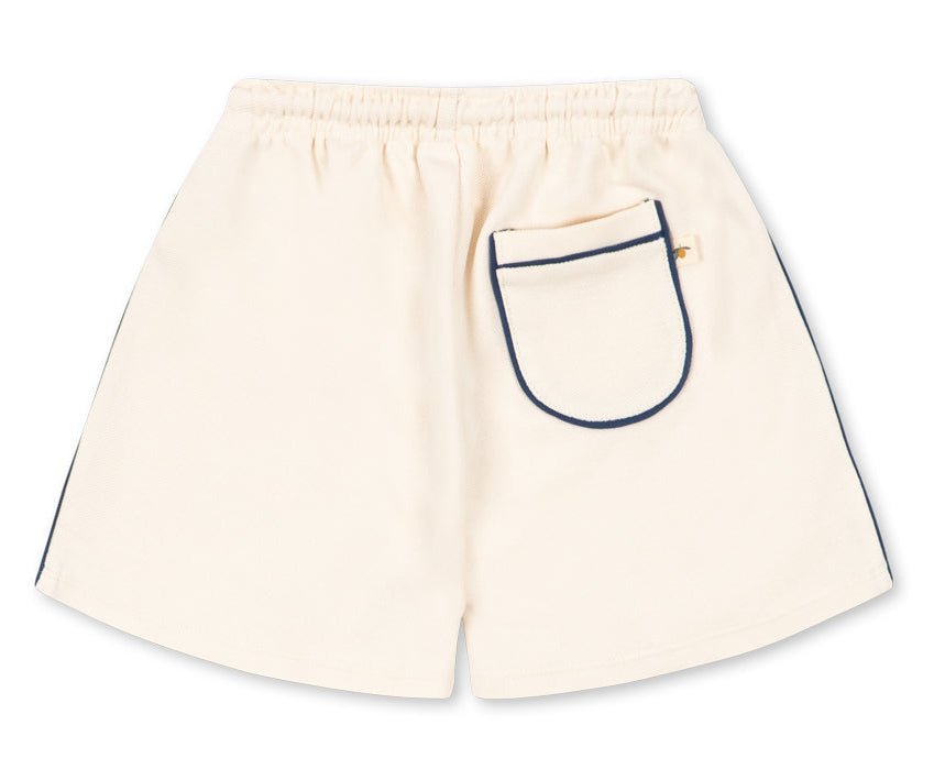 Introducing the Baby Boys’ and Boys’ Florian Shorts from Konges Slojd—crafted from cream-colored organic cotton, these stylish shorts feature an elastic waistband with a comfortable drawstring, plus a single back pocket outlined in dark trim for added practicality.
