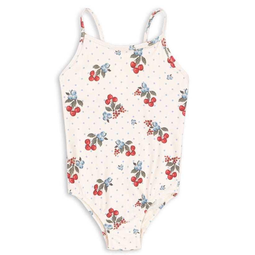 The Konges Slojd Baby Girls’ and Girls’ Frago Swimsuit is a cream-colored one-piece featuring thin straps, playful cherry and blueberry prints, and charming blue polka dots. This comfortable, stretchy swimsuit is perfect for active days by the water.