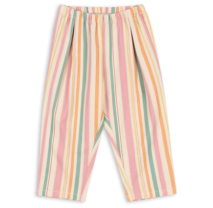 The Konges Slojd Baby Girls’ and Girls’ Frankie Pants, made from organic cotton twill, feature an elastic waistband and vertical pastel stripes in pink, yellow, orange, green, and white. The pants are shown laid flat on a white background.