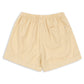 Konges Slojd Baby Boys’ and Boys’ Franzen Linen Shorts in beige, featuring an elastic waistband and a single back pocket, displayed flat on a white background.