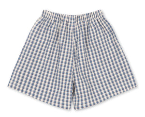 Baby Boys’ and Boys’ Kim Shorts by Konges Slojd, featuring a blue and white checkered pattern with an elastic waistband, crafted from breathable organic cotton for all-day comfort, displayed flat on a white background.