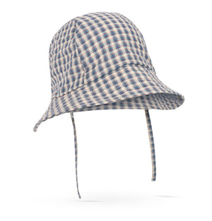 The Konges Slojd Baby Boys’ and Boys’ Sun Hat, featuring a blue and beige plaid organic cotton design with a wide brim and chin straps, is shown against a white background.