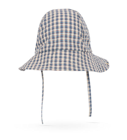 The Konges Slojd Baby Boys’ and Boys’ Sun Hat, featuring a blue and beige plaid pattern, is made from organic cotton and includes a wide brim and chin straps. It is displayed on a white background.