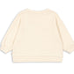 The Kids’ Loupy Lou Sweatshirt by Konges Slojd is shown from the back in a cream color, featuring long sleeves with ribbed cuffs, waistband, and crewneck collar. Laid flat against a white background, this sweatshirt is crafted from soft cotton fabric for comfort and durability.