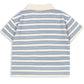 The Boy’s Spotty Short Sleeve Polo by Konges Slojd features a relaxed fit with short sleeves and blue and beige horizontal stripes, shown from the back against a white background.