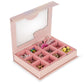 The ABC Jewelery Set by Konges Slojd is a pink bead box with a clear lid, featuring 9 compartments of colorful trinkets and letter pearls for jewellery making.