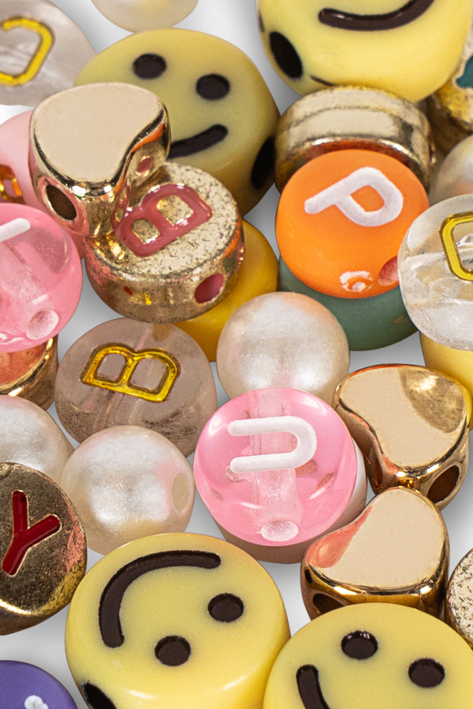 The ABC Jewelery Set by Konges Slojd features assorted colorful beads, smiley faces, letter pearls, and metallic accents—ideal for jewellery making.