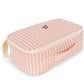 The Konges Slojd Baby Doll Nursery Suitcase is a pink and white gingham zippered pouch with a handle and cherry embroidery, ideal for accessories or your soft doll.