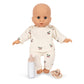 The Baby Doll Nursery Suitcase by Konges Slojd features a soft bald doll in cherry pajamas with nursery accessories, perfect for imaginative play.