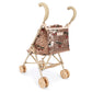 The Sparkly Doll Stroller by Konges Slojd is a small, gold stroller for dolls with beige handles, washable sequin fabric, and a patch label on the shiny seat and backrest.