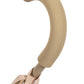 Close-up of a beige, washable fabric-covered curved handle attached to a metal rod on the Konges Slojd Sparkly Doll Stroller.