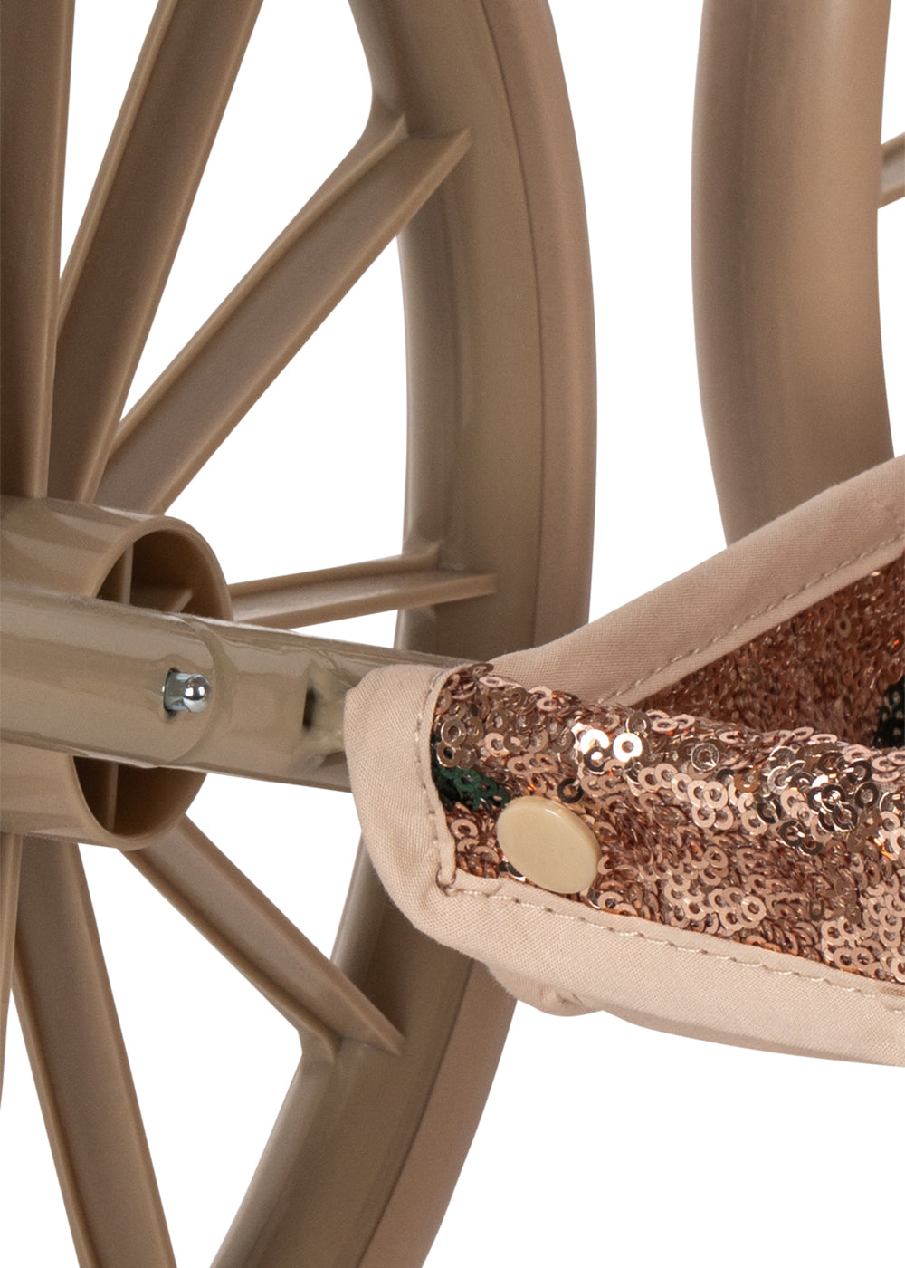 Close-up of a Konges Slojd Sparkly Minnie Doll Pram, featuring a vintage-style frame, brown plastic wheels, and a seat covered in metallic sequin fabric.