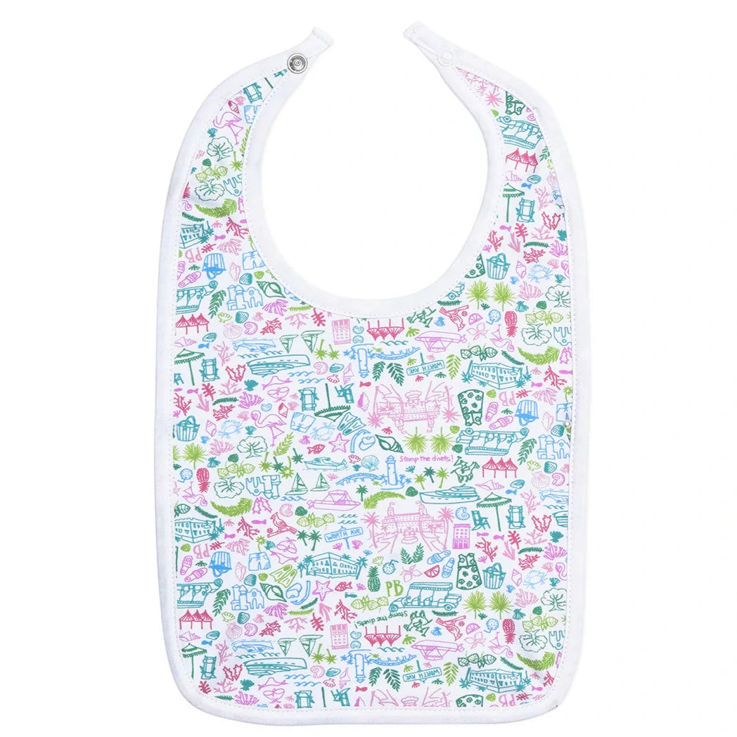 The Joy Street Palm Beach Bib by Joy Street is a white baby bib adorned with vibrant, iconic images of carousels, castles, and flowers, evoking the charm of Palm Beach.