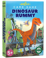 Eeboo's Dinosaur Rummy Playing Cards come in a colorful box featuring an illustrated orange dinosaur and pterodactyl. This family-friendly game has a vibrant card deck, recommended for ages 5 and up.