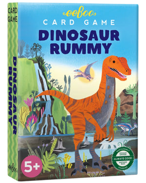 Eeboo's Dinosaur Rummy Playing Cards come in a colorful box featuring an illustrated orange dinosaur and pterodactyl. This family-friendly game has a vibrant card deck, recommended for ages 5 and up.