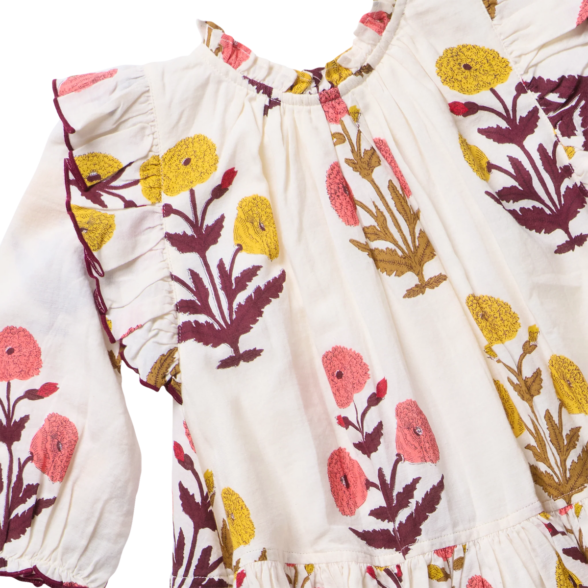 The Baby Girls’ Harper Dress Set by Pink Chicken features soft cotton, ruffled shoulders, and harvest dandelion embroidery in yellow, pink, and burgundy florals.