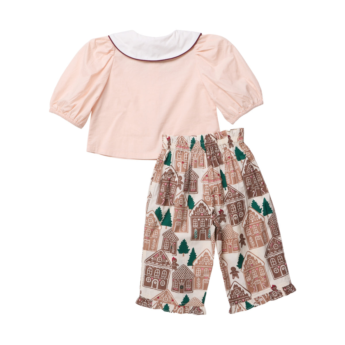 Baby Girls’ Noelle 2-Piece Set featuring a light pink puff-sleeve top with a white collar and cropped pants with a gingerbread house and pine tree print.