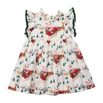 Pink Chicken Girls’ Jennifer short-sleeve Santa Sleigh dress with a ruffled collar and green velvet trim, featuring a holiday print of Santa in a sleigh pulled by reindeer among pine trees.