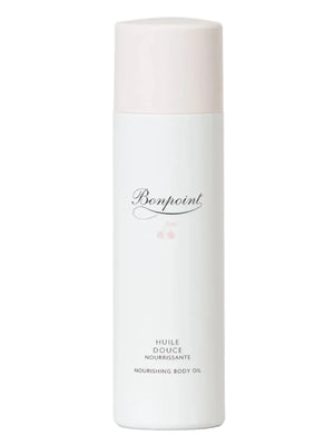 The Bonpoint Baby Bath Set features a minimalist design with a white bottle and light pink cap, making it ideal for newborn essentials or as a thoughtful addition to any baby gift box.