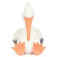 Jellycat's Keli Pelican plush toy, featuring white fur, an orange beak and feet, and gray wingtips, sits upright against a plain background—ready to host the next episode of "The Beak" talk show.