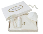 The Bonpoint Baby Bath Set includes newborn essentials: a plush bunny toy, skincare bottle, white baby hat, and hooded towel, all beautifully presented in a branded white box—an ideal gift for baby bath time.