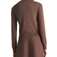 A woman is shown from the back wearing the Lela Rose Raffia Embroidered Knit Long Sleeve Cardigan with a matching skirt, both in brown cozy knit, set against a white background.