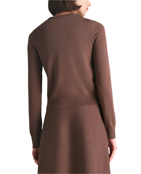 A woman is shown from the back wearing the Lela Rose Raffia Embroidered Knit Long Sleeve Cardigan with a matching skirt, both in brown cozy knit, set against a white background.