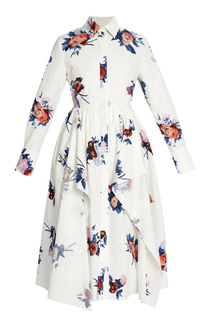 The Erdem Long Sleeve Midi Shirt Dress features white cotton poplin, a collared button front, an asymmetrical overlay, and vibrant blue, red, and purple rose bouquets.