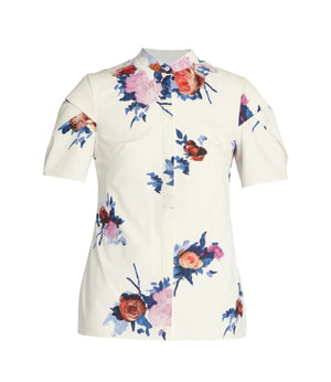 The Erdem Painted Rose Bouquet Short Sleeve Top is a white cotton poplin shirt with a collar and vibrant pink, red, and blue floral print.