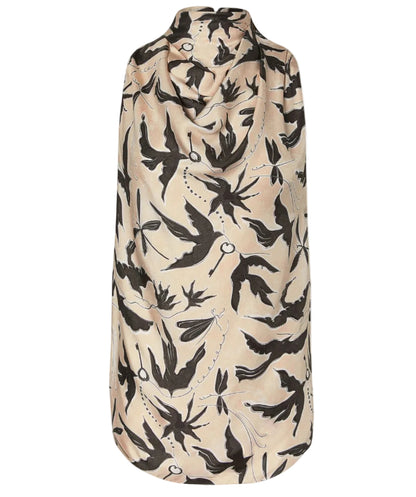 A sleeveless beige cape with a black bird and chain pattern, shown from the back, layered over the Altuzarra Sleary Top for effortless sophistication.