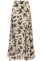 The Elton Skirt by Altuzarra is a beige midi skirt with a fitted waist, flared silhouette, and a black bird and floral print pattern.