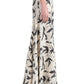 A person stands in profile against a white background, wearing the Altuzarra Elton Skirt—a long, cream skirt with a black abstract print and a fitted waist.