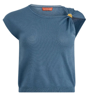 The Altuzarra Rinaldi Top is a blue short-sleeve knit with a round neckline, gathered shoulder detail, and chic gold hardware accent on one side.