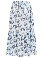 The Olina Midi Skirt by Ulla Johnson is a white cotton-blend skirt with a black abstract leopard print and a ruffled hem.