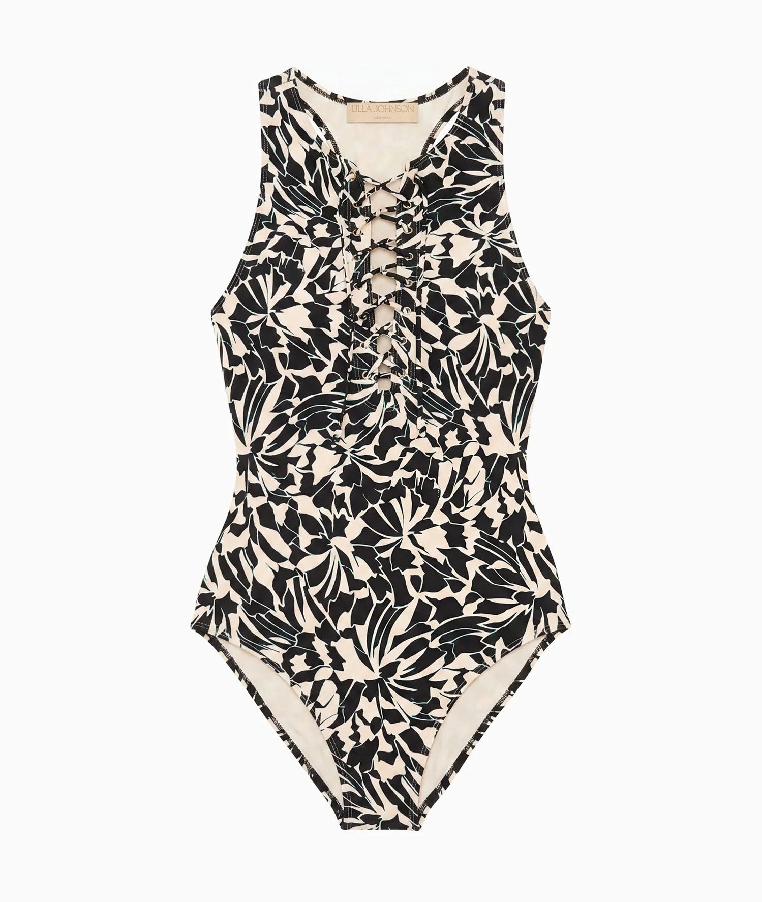 The Solina One Piece by Ulla Johnson is a sleeveless swimsuit showcasing a bold black and white leaf motif with sophisticated front lace-up detailing, presented against a plain white background.